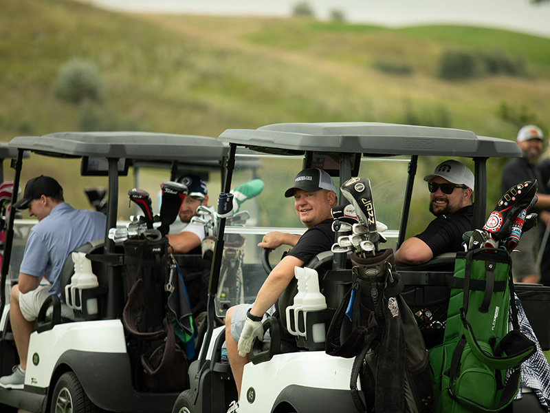 Members in golf carts