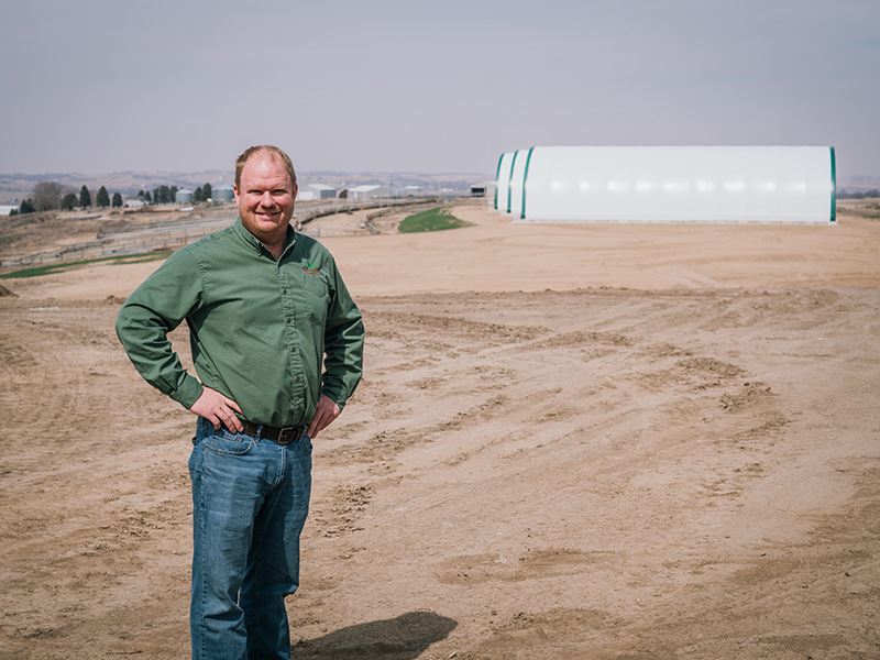 Abe Sandquist standing on the site of a future WINR Center