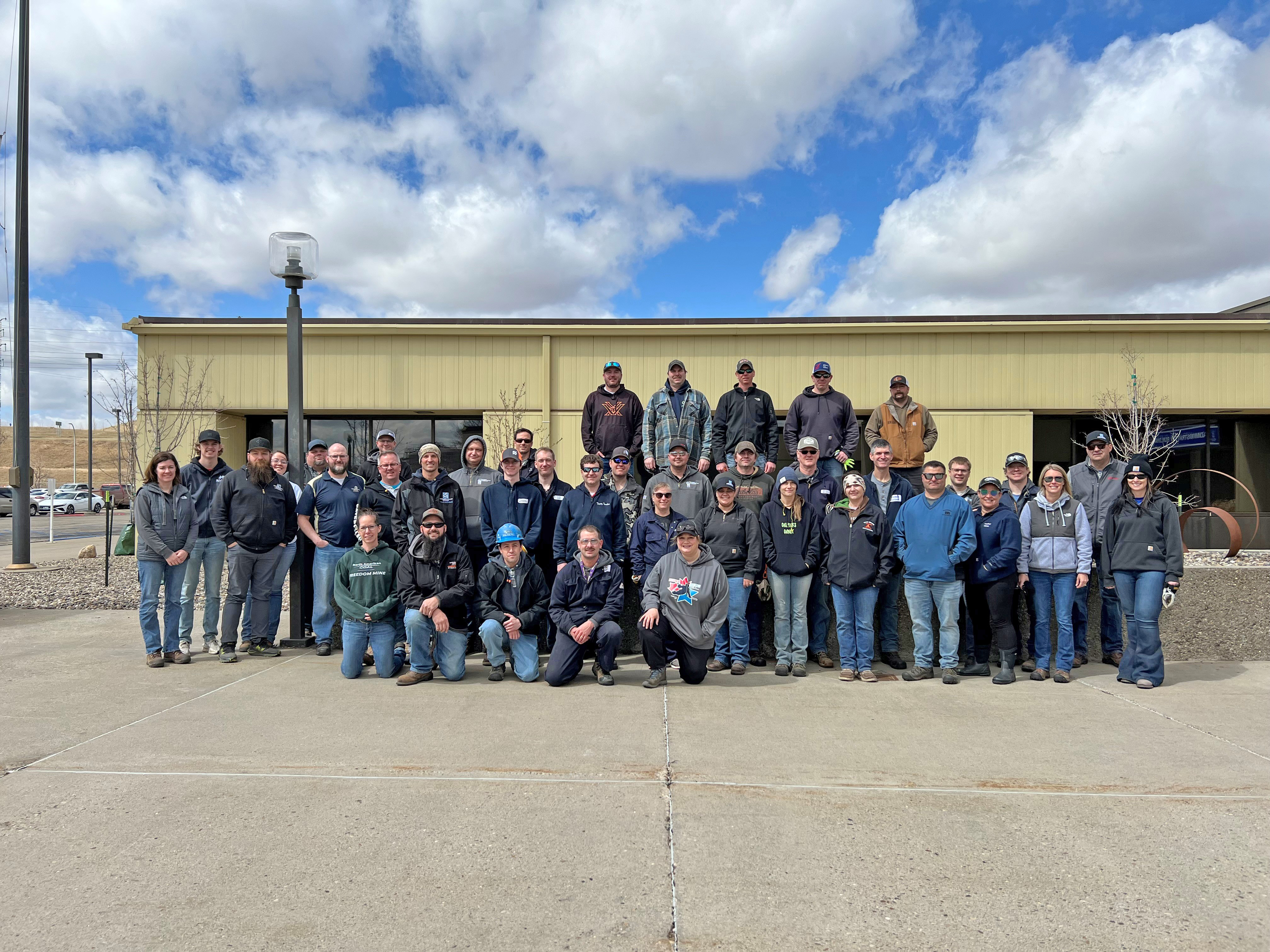 Volunteers line up for a photo after completing the cleanup event