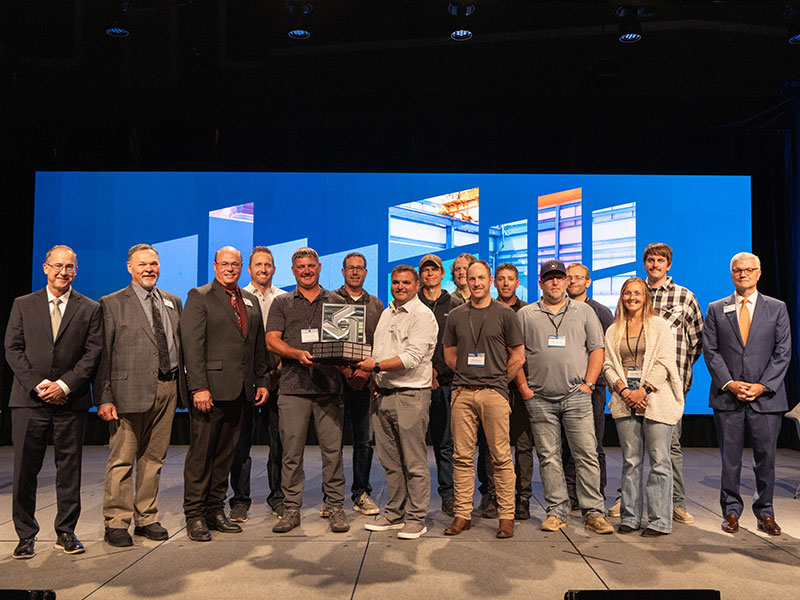 Onstage award presentation to the Antelope Valley Station team