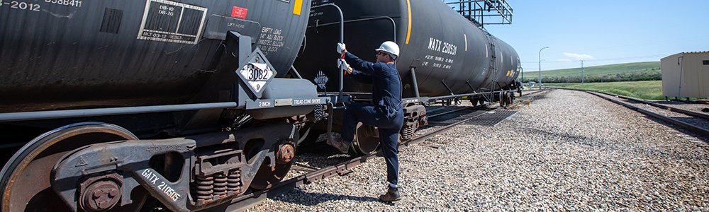 Employee using step on railcar