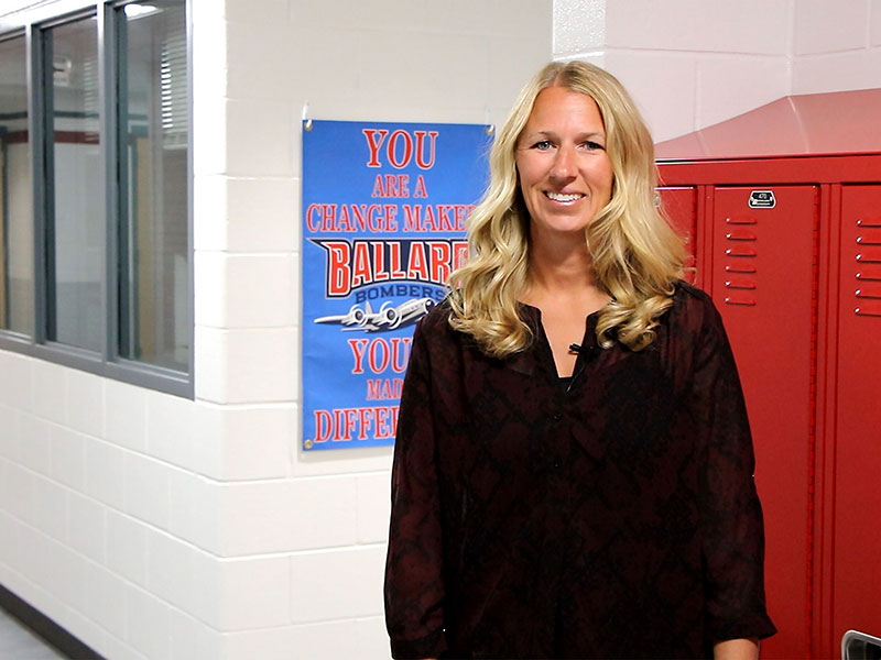 woman standing in front of lockers