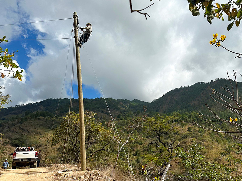 Montana lineworker installing power in Guatemala
